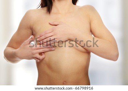 Breast cancer check- Woman holding her breast