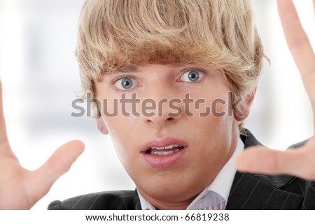 Scared young businessman