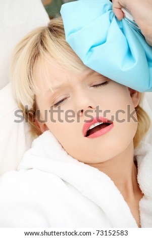 Sick woman at home with terible headache