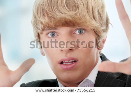 Scared young businessman