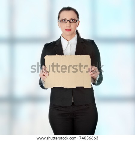 Unemployed businesswoman with empty cardboard sign