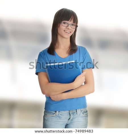 Teen student girl with note pad,isolated on white background
