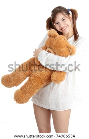 Teen girl with teddy bear, isolated on white background