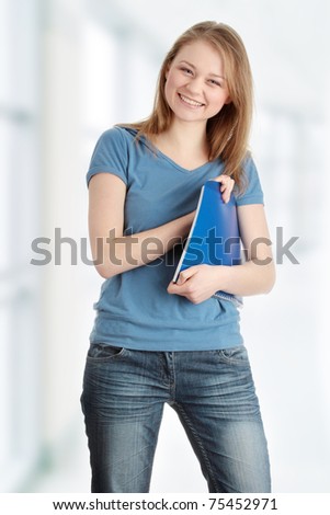 Young student woman isolated on white background