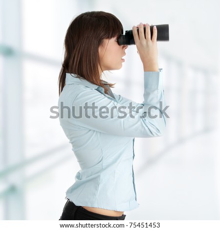 Young caucasian business woman looking through binocular isolated on white background