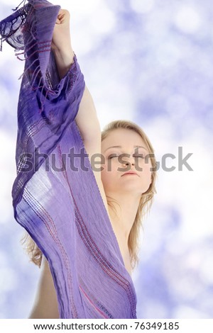 Sensual portrait of young beautiful caucasian woman dancing with wind.