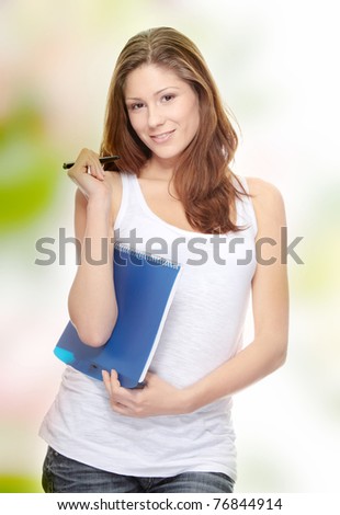 Student woman with note pad and pen isolated on white background