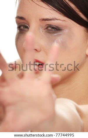 Abused woman crying over white background