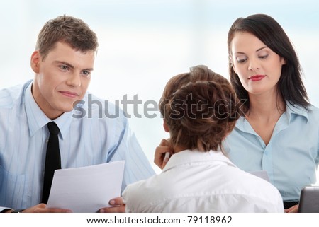 Business coaching concept. Young woman being interviewed for a job.