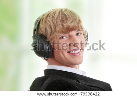 Young businessman relax with music sitting on wheel chair
