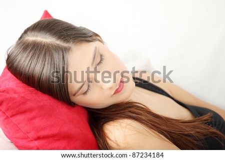 Young woman\'s sleeping on couch. In home.
