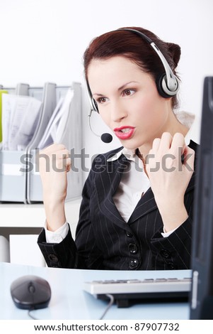 Angry  businesswoman talking by headset.