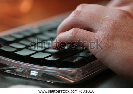 hand typing keyboard side orange macro black keys