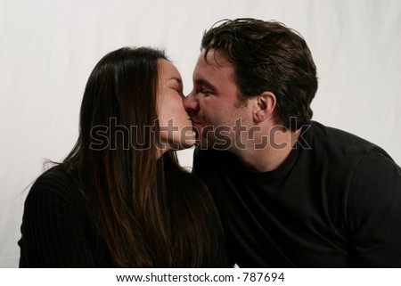 woman kissing man