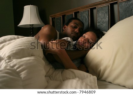 Black couple in bed