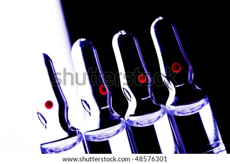 Glass vials with red spots. high contrast