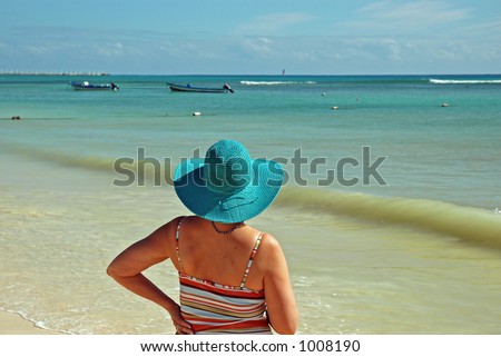 Lady at the Beach watching the boats
