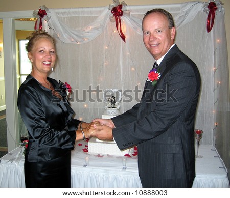A middle-aged couple at their wedding celebration