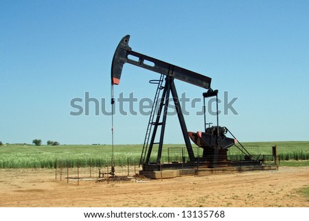 A grasshopper pump pumping oil from the ground