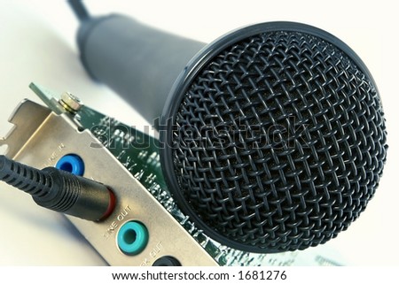 Studio microphone and computer sound card close-up