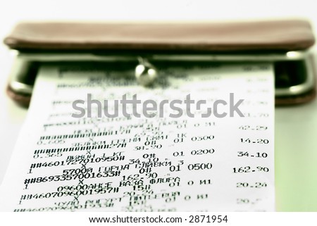 Cash receipt on background of a purse-how to spend money without damage to the family budget