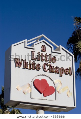 stock photo vegas wedding chapel sign against colbot blue sky with palm 