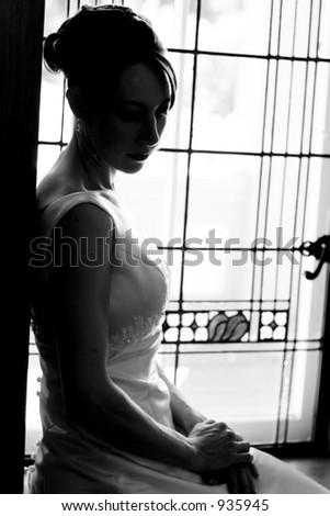silhouette of woman  (bride) at  window