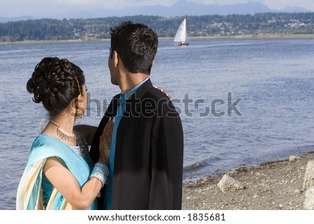Indian wedding bride and groom at seaside