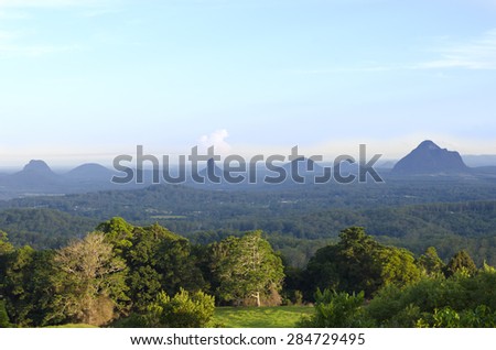 Panoramic view of the Glasshouse Mountains, Sunshine Coast, Queensland, Australia. These are a group of hills that rise abruptly from the coastal plain.