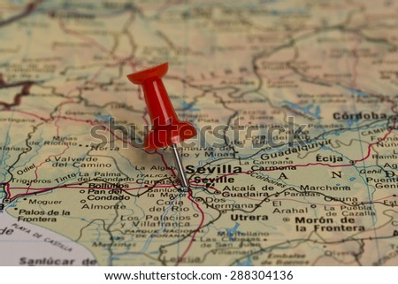 Sevilla (Seville) marked with red pushpin on map. Selected focus on Sevilla and pushpin. Pushpin is in an angle.