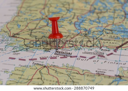 Helsinki marked with red pushpin on Finland map. Selected focus on Helsinki and pushpin.