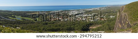 Scenic panorama view of Sunshine Coast from Mount Coolum. Blue skies with few clouds, Mudjimba and Moloolaba bay on can be seen on the horizon and the Coral Sea.