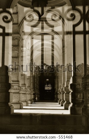 A shot of the entrance of the palace of justice in Rome, through the bars at the entrance. THe bars are reflected of a pane of glass. Quadtoned to bring out contrast. Scanned from film.