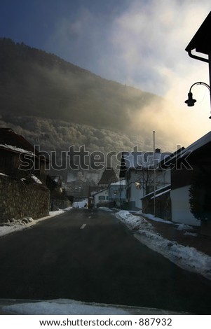 a village road during sunrise on the way up to the duke\'s castle in lichtenstein.