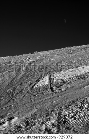 Ski slope at its purest -- clear sky, white snow, traces of wintersport visible.