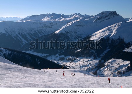 Skiers on their way down into the valley. Taken in Davos, Switzerland.