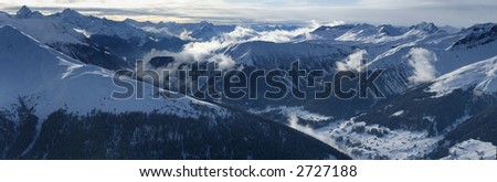 Very high resolution alpine panorama showing snow covered mountains and dramatic clouds. No sharpening applied.