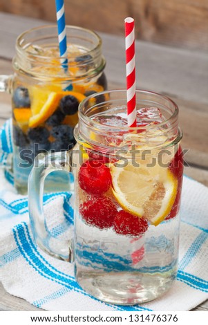 Ice cold sparkling water over ripe fresh fruit make for a healthy and thirst quenching beverage on a hot summer day.