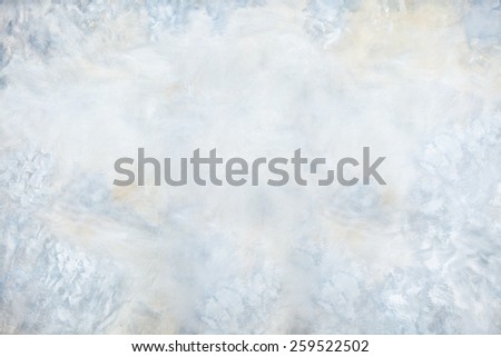 Abstract painted background in subtle shades of blue, gray, and peach.