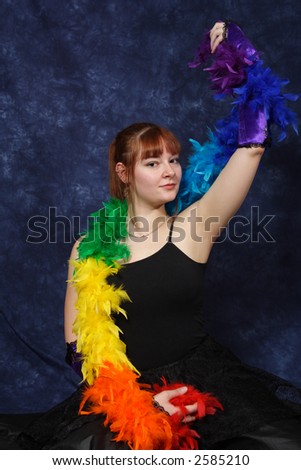 A serious musical theater student ends her dance with a flamboyant pose.