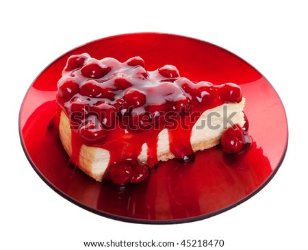 stock photo Decadent cherry cheesecake served on a candy apple red plate