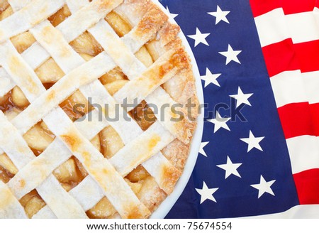 As American as apple pie as the saying goes.  Fresh apple pie on an American flag.