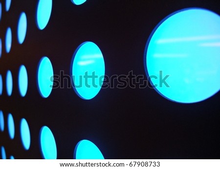 Stylish abstract blue glowing circles or spheres on Black background