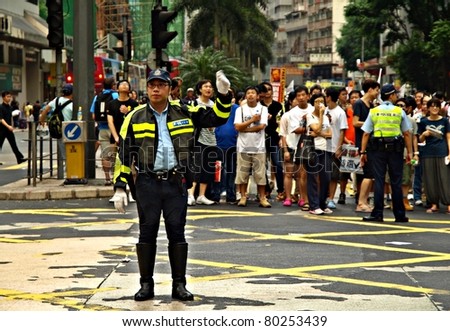 HONG KONG, CHINA - JULY 1: Hong Kong citizens/ people participated in the annual July 1 March demand for democracy with police control from the government on July 1, 2011 in Hong Kong, China
