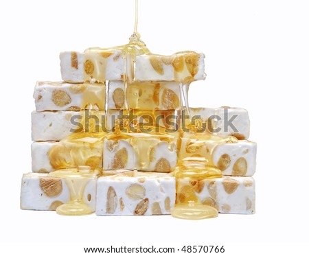 Kendi i Çokollatave Stock-photo-french-nougat-with-honey-pouring-all-over-it-48570766