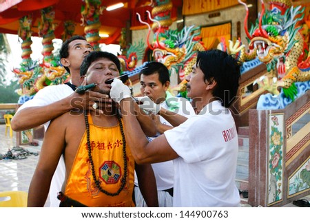 PHUKET - OCTOBER 3: Entranced worshipper during the Vegetarian Festival October 3, 2012 in Phuket, Thailand.