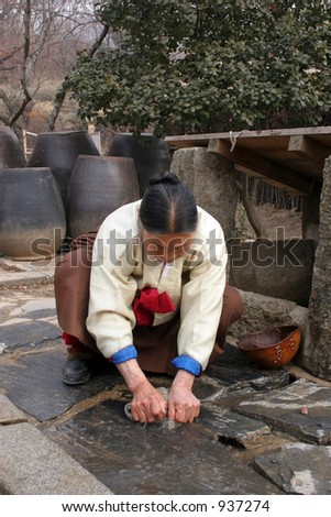 Korean woman handwashing cloth at Suwon Folk Village, South Korea