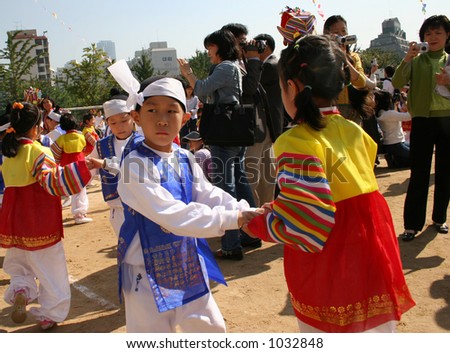 Reluctant dance partner - Korean school children performing a traditional dance