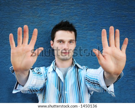 Man with his hands up in a defensive stance