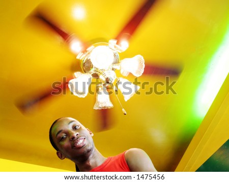 Jamaican man under a spinning light